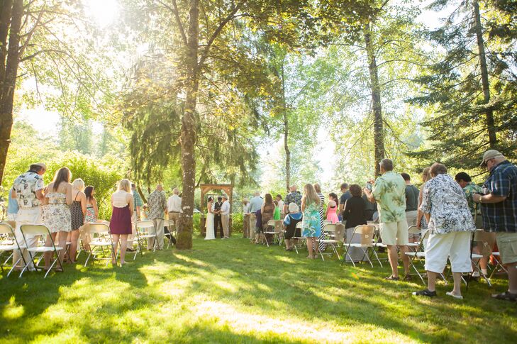 “We chose Michael's childhood home, where his father still lives,” says Jessica. “The house sits on 2 acres surrounded by trees and on the bank of the Cedar River. Not only was this exactly the setting we wanted to have for our wedding it was sentimental and was a great savings on our budget.”rn