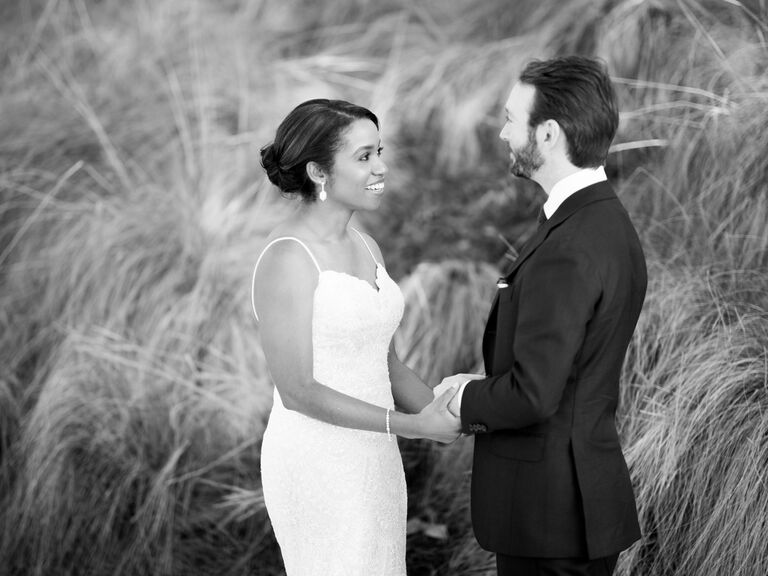 Couple holding hands during first look