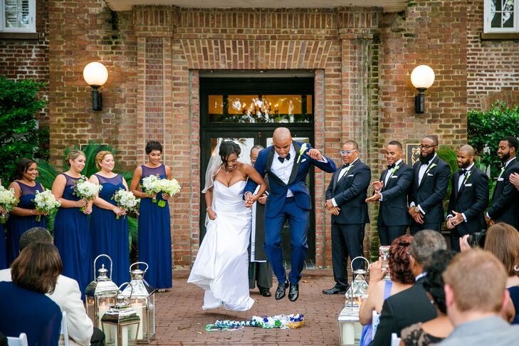 After Josh’s father pronounced them husband and wife, Josh dipped Shayna like a true pro and the pair jumped the broom before heading back up the aisle as Mr. and Mrs. Bulluck. “My mother decorated one in blue, silver and mint and it’s now hanging on one of our walls,” says Shayna.