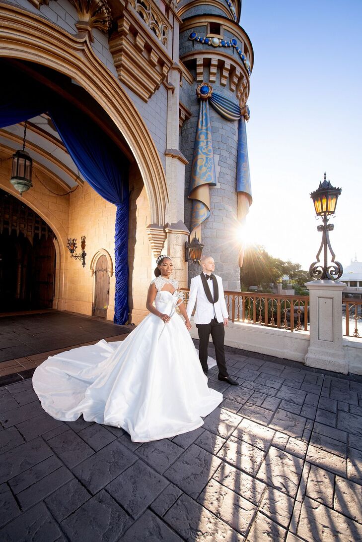 Bride in Ballgown and Groom in Tuxedo Exiting Cinderella Castle in Walt Disney World