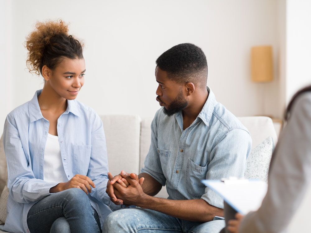 Millennial couple talking during couples therapy session