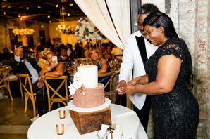 Couple Cutting Wedding Cake at Mt. Washington Mill Dye House in Baltimore, Maryland