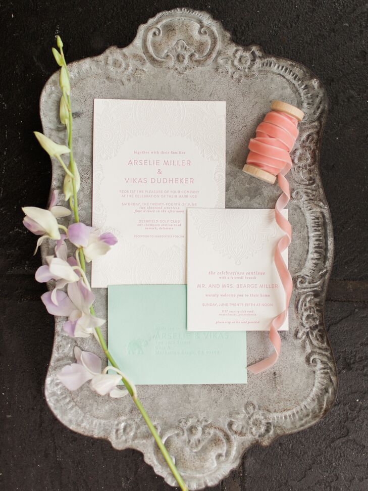 Arselie worked with Britt from SwellPress Paper Co. to design and create their save the dates and invitations. "Since we were combining cultures there just wasn't anything already in existence that seemed to fit what we were going for," says Arselie. "I was in love with the design Britt created for us on her letterpress—incorporating beautiful hand-drawn henna details, elephants and exactly the coloring to match our wedding motif."