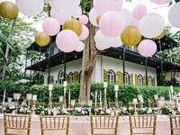 Wedding venue decorated with lanterns, tables adorned with candles