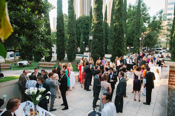 Guests enjoyed cocktails among the tall, narrow pine trees and lightposts of Cafe Pinot in Los Angeles.