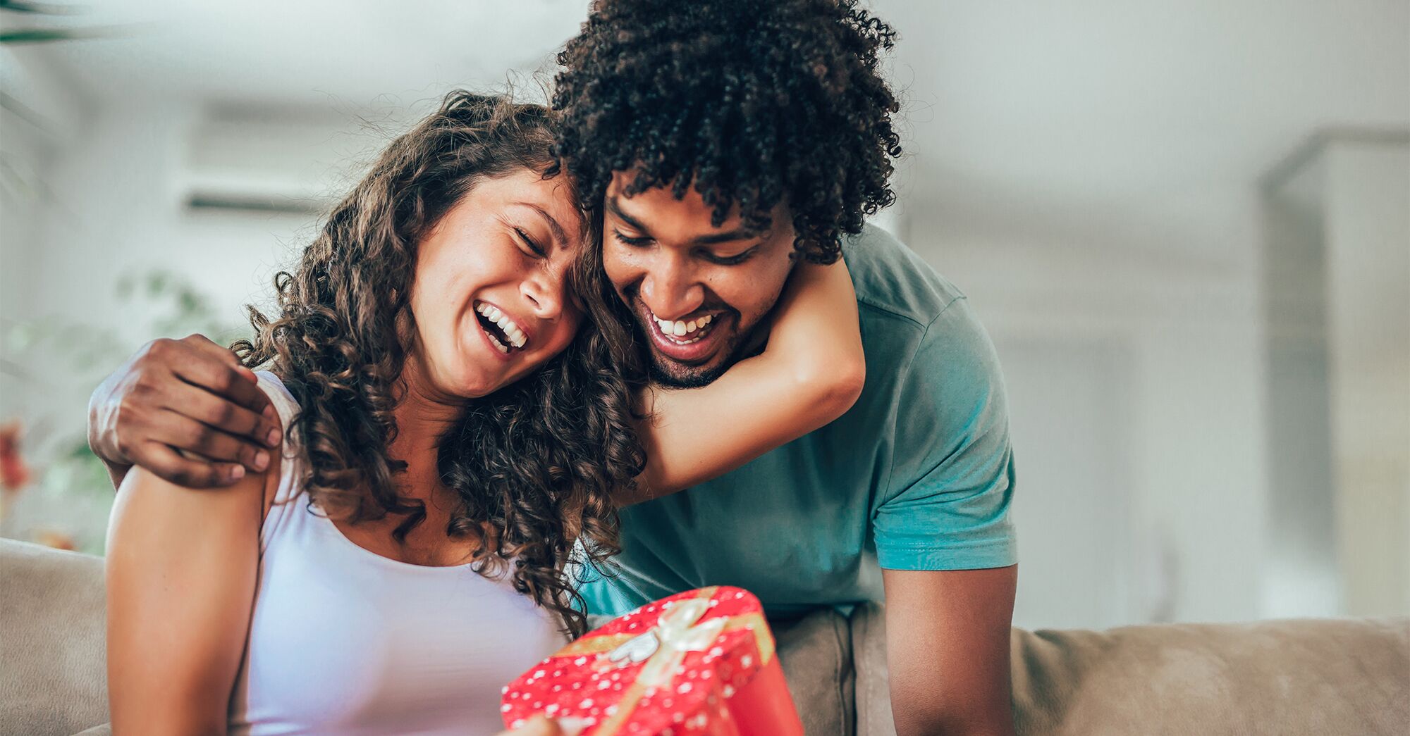 Husband Giving Xmas Present To Wife Making Surprise At Home Stock Photo by  ©Milkos 421239972