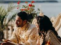 Beautiful couple participating in a traditional Cambodian wedding cereromy called Sompeas Ptem. 