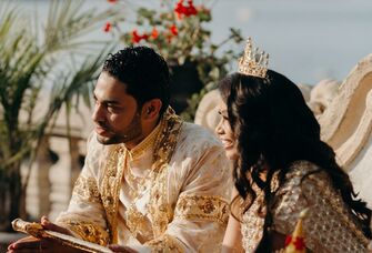 Beautiful couple participating in a traditional Cambodian wedding cereromy called Sompeas Ptem. 