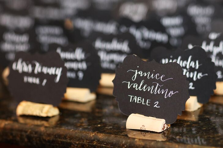 Cassandra and Melissa created place card holders out of corks and artfully wrote the names of friends and family members in white calligraphy on black paper.