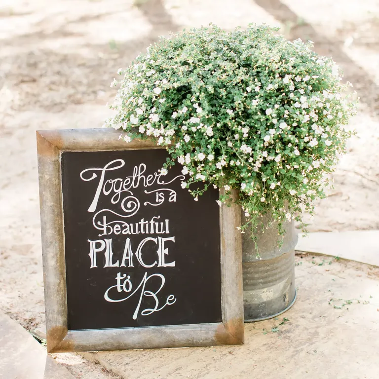 Black and white chalkboard engagement photo sign prop