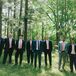 The groomsmen wore their own navy or gray suits with peach and coral ties.