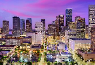 Downtown Houston skyline and purple sunset sky