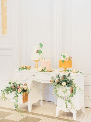 Different Wedding Cakes Atop Vintage Desk