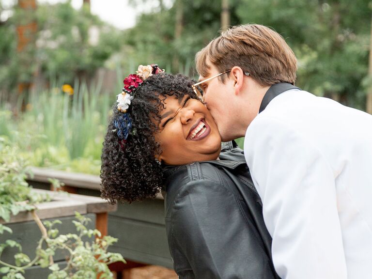 Bride and groom share a happy moment together at their wedding