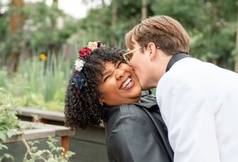 Bride and groom share a happy moment together at their wedding