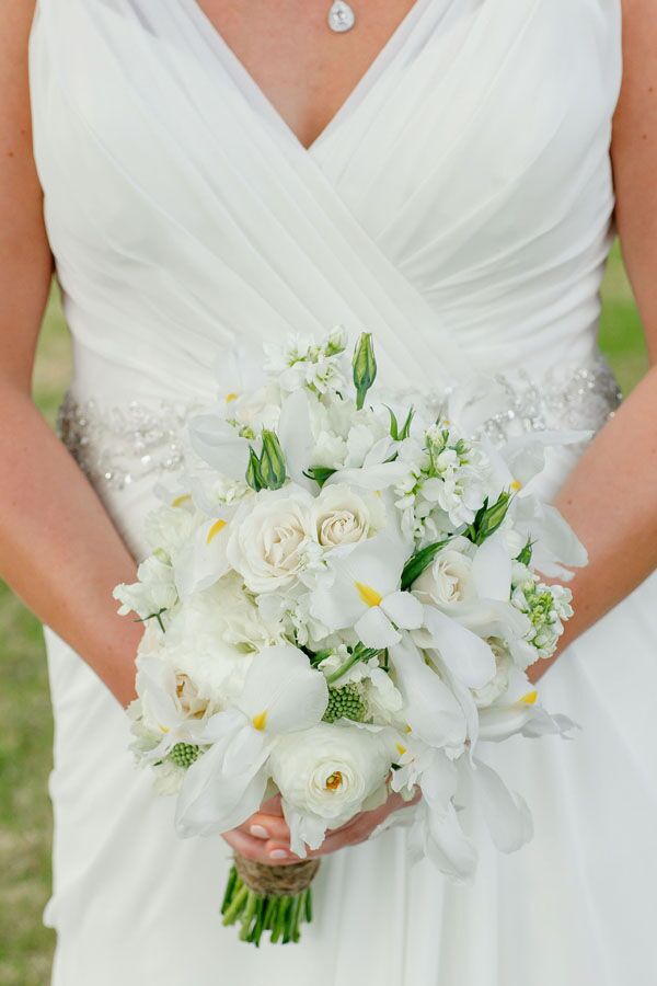 Hailey carried an all-white bouquet of irises, roses, ranunculus and stock. She selected white blooms to reflect her simple, vintage style.