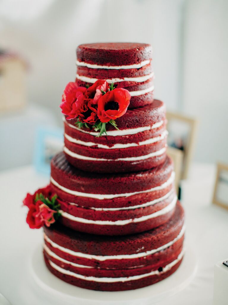 four-tier naked red velvet cake decorated with red anemone flowers