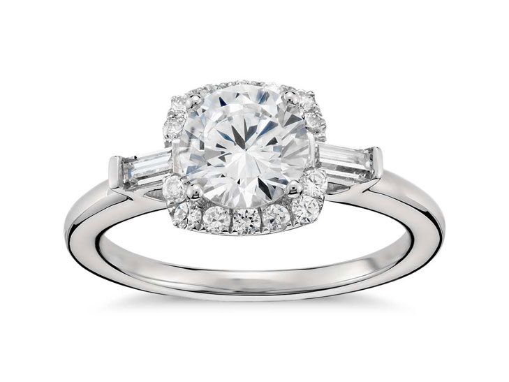 round cut engagement ring with tapered baguettes