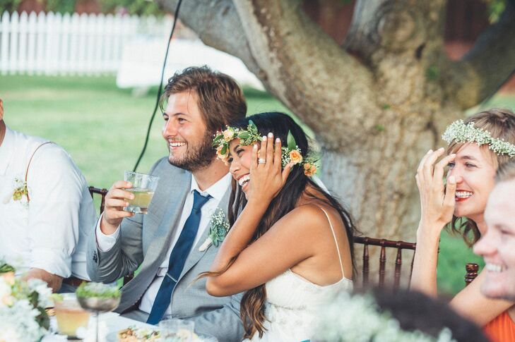 Colin wore a light gray suit with a blue tie on the wedding day.