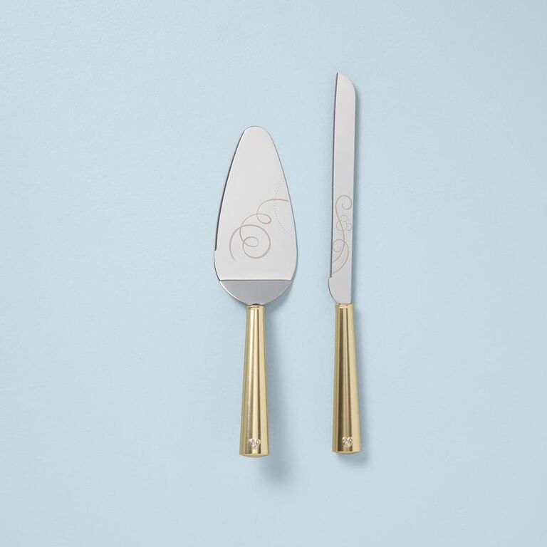 Engraved silver and gold cake cutting set by Lord & Taylor. 