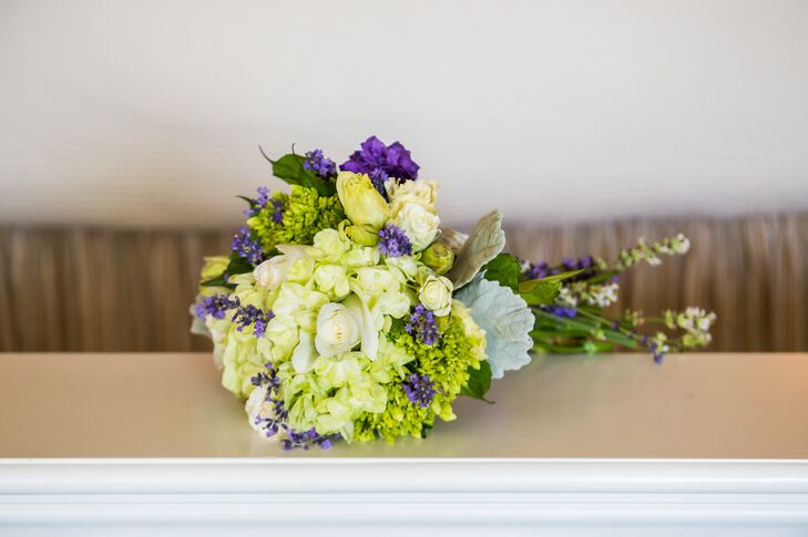 Liz held a bouquet of hydrangeas, roses, lavender and button mums. The purple and green hand tied bouquet popped against Liz's champagne and ivory wedding dress.