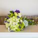 Liz held a bouquet of hydrangeas, roses, lavender and button mums. The purple and green hand tied bouquet popped against Liz's champagne and ivory wedding dress.