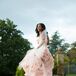 “I never really envisioned myself in a white dress,” Claudette says. “I liked the idea of blush, and when I saw the Vera dress on the hanger, I had to try it on. It was between that dress and an ivory one in another store. I went home and couldn’t stop thinking about the blush dress. So I went back, tried it on again and cried!” The dropped-waist gown was the perfect fit for the elegant estate affair, with its whimsical textured skirt, pleated organza and soft, pink hue.