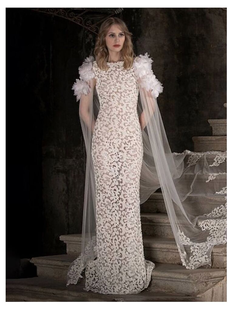 kleinfeld bridal white and nude high neck wedding dress with puffy ruffle short sleeves allover lace flowy skirt and lace mesh cape