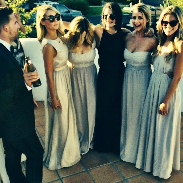 Lauren Conrad and other bridesmaids smile for the camera at a wedding. 