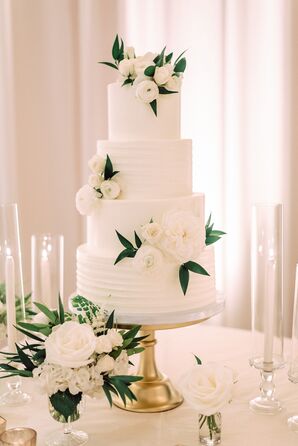 Glamorous Round Tiered Buttercream Cake with White Flowers on Gold Cake Stand