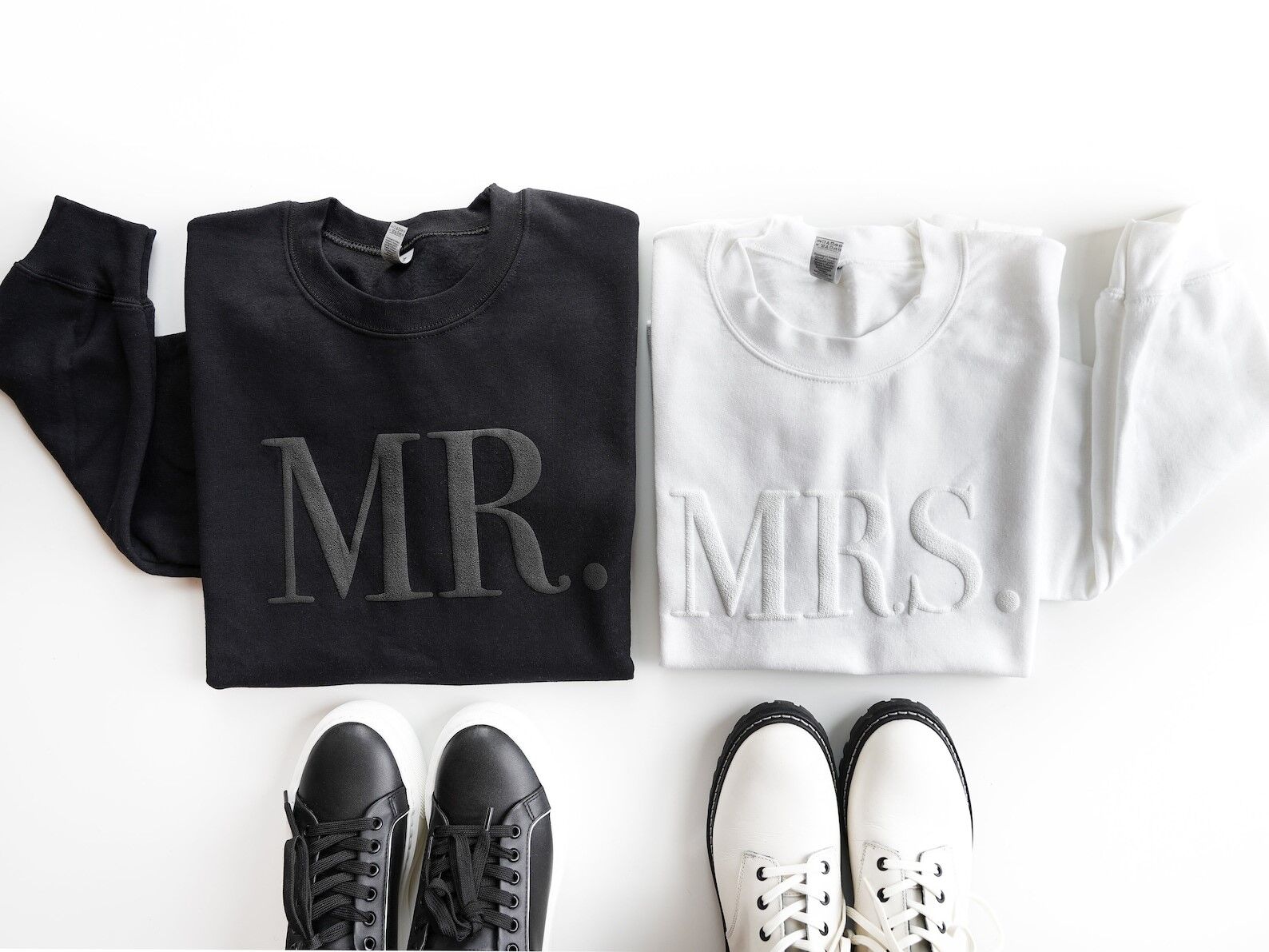 Mr. and Mrs. matching couples' sweatshirts in black and white. 
