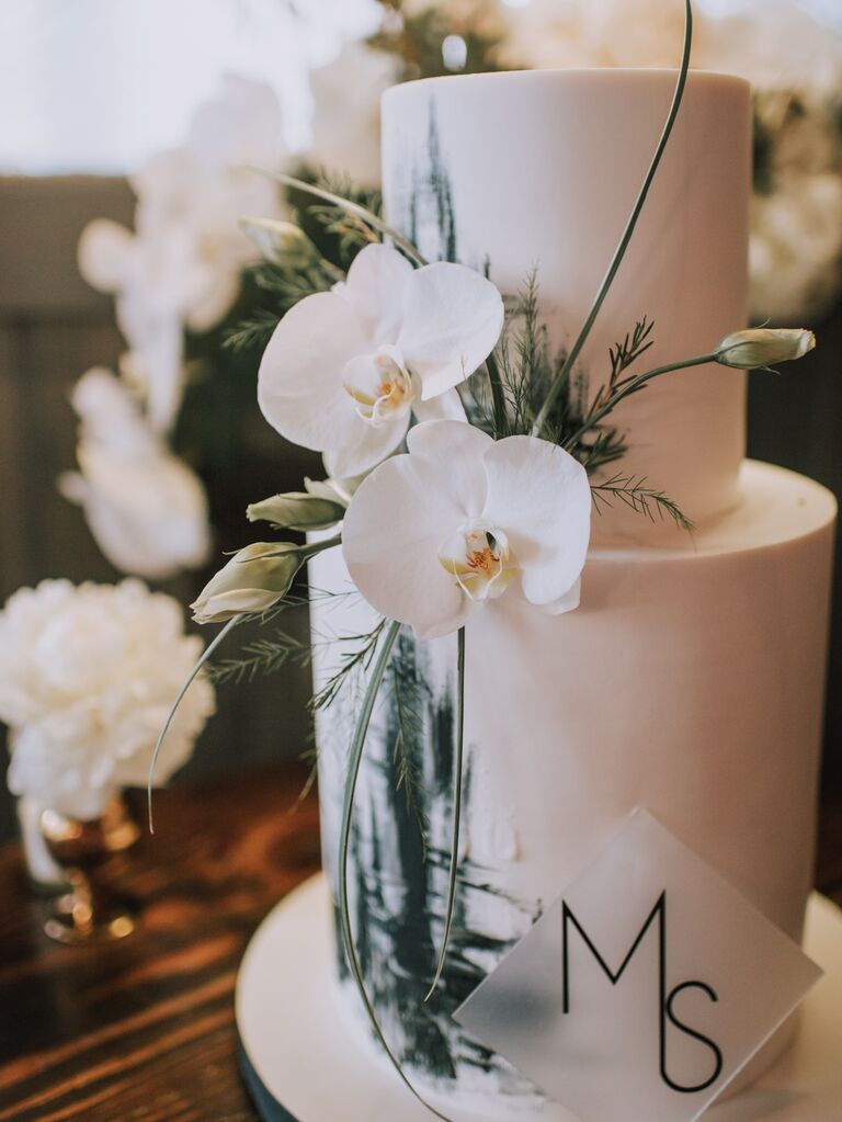Beautiful bridal shower cake with fresh orchids. 