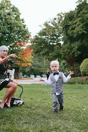 Adorable Ring Bearer in a Navy Bow Tie and Gray Vest