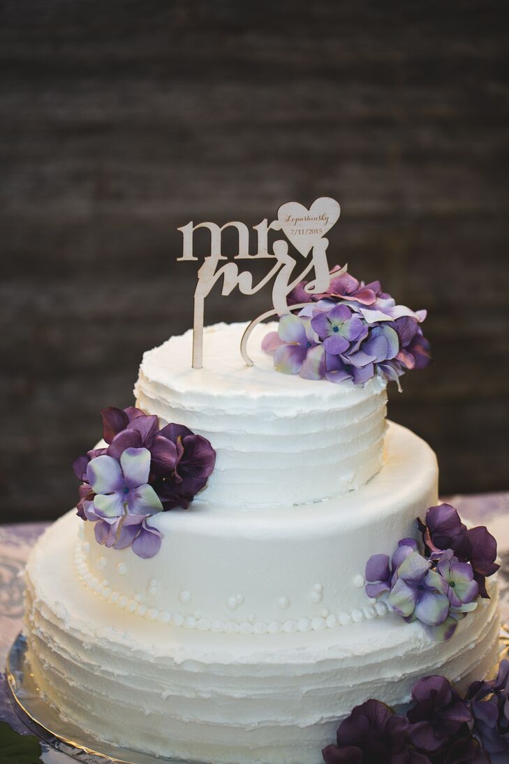 Two-Tier White Wedding Cake With Purple Flowers