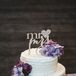 Two-Tier White Wedding Cake With Purple Flowers