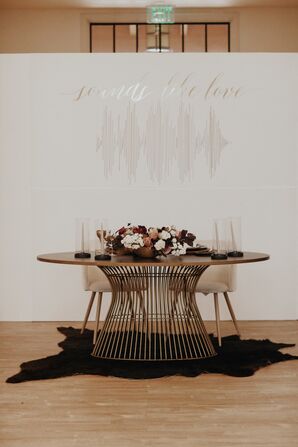 Modern Metal Sweetheart Table With Black Rug and Velvet Chairs