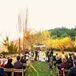 The couple wed in an orchard under a floral-decorated huppah.
