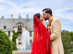 Isha and Adam's vibrant red-hued wedding at Oheka Castle in Huntington, New York, was equal parts traditional and glam, and all-around stunning. For t