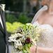 Chelsea held an overflowing bouquet that embodied a natural feel. The arrangement included white calla lilies, lilies of the valley, scabiosa pods and an abundant amount of greenery.
