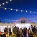 Katie was set on the idea of having string lights below a starry sky over the dance floor. “I will never forget seeing the tables and lights all set up on the deck overlooking Lake Calhoun with the Minneapolis skyline in the background. It was magic!” says the bride.