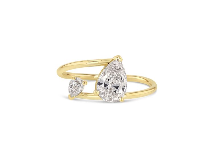 two stone ring in yellow gold setting with larger pear shaped diamond and smaller pear shaped diamond