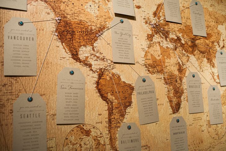 The couple had a friend frame a vintage map, which was used as a seating chart. We pinned city and country names and used twine to hold each of the table names where guests were sitting, explains Danielle.