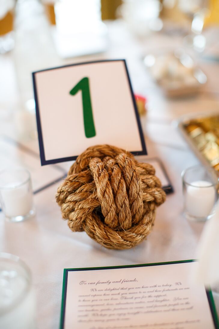 As a nod to the wedding's subtle nautical theme, the table numbers were displayed on nautical rope knots.