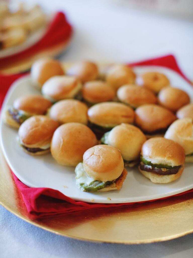 mini sliders on a plate with red napkins