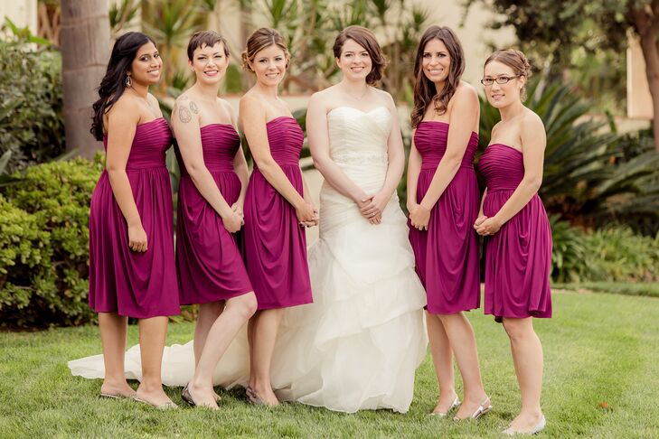 The bridesmaids wore strapless jersey knit dresses in a vibrant berry red.  The bride wore a strapless, multi-layered gown with a beaded belt sewn in for extra sparkle. She borrowed a diamond necklace that had belonged to her grandmother and had been used in other family weddings.