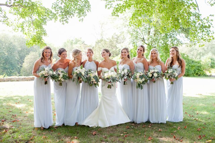 Rebecca had her bridesmaids wear the same gown: a floor-length, strapless style from Dessy Group in a cool, frost blue hue. The girls accessorized with gold diamond bracelets, a gift from Rebecca, and simple drop or stud earrings.