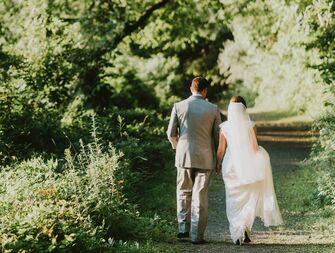 bride and groom walking away from camera