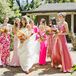 Bride in Sleek Gown With Bridesmaids in Hot, Bright Pink Dresses, Wildflower Bouquets