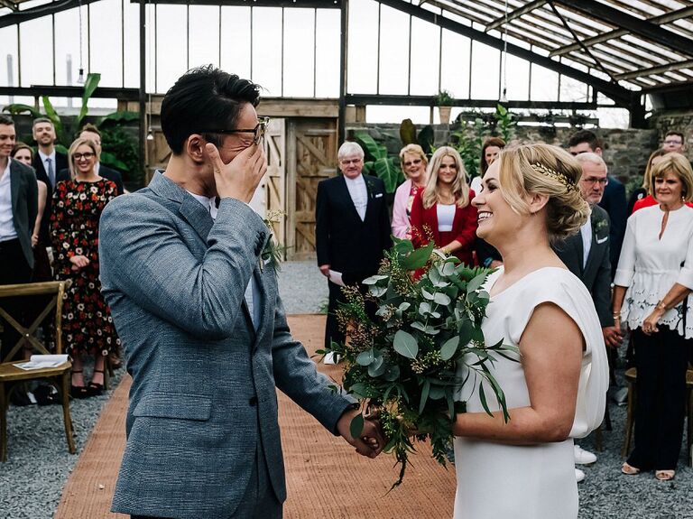 Groom wiping away tears
