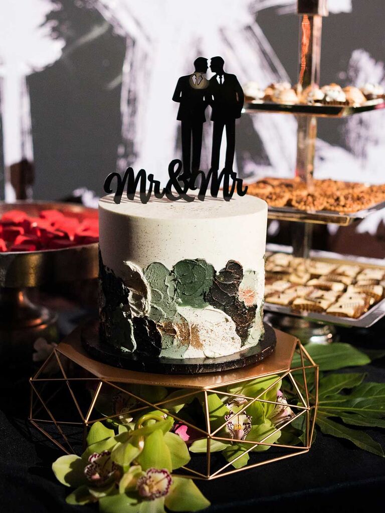 Small hand-painted wedding cake on geometric cake stand